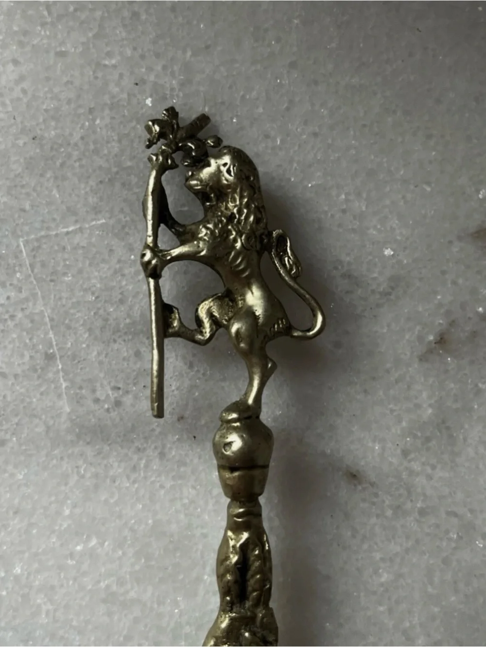 vintage Italian serving utensils are an ornate brass fork and spoon set